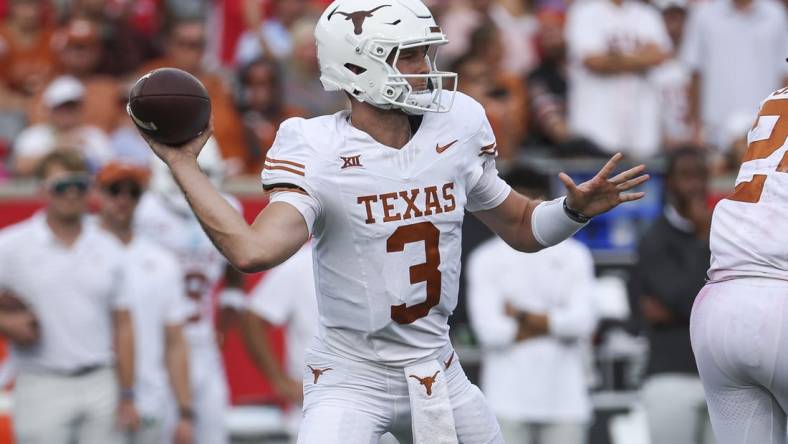 Oct 21, 2023; Houston, Texas, USA;  Texas Longhorns quarterback Quinn Ewers (3) attempts a pass during the third quarter against the Houston Cougars at TDECU Stadium. Mandatory Credit: Troy Taormina-USA TODAY Sports