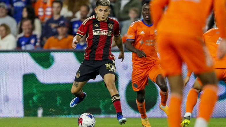 Oct 21, 2023; Cincinnati, Ohio, USA; Atlanta United FC midfielder Thiago Almada (10) dribbles against FC Cincinnati in the second half at TQL Stadium. Mandatory Credit: Katie Stratman-USA TODAY Sports