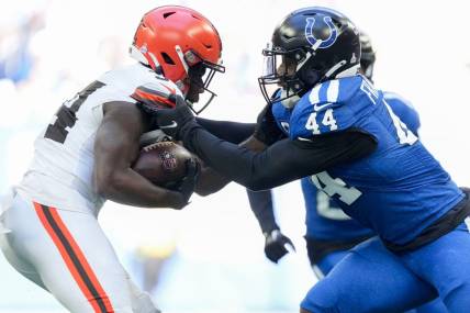 Indianapolis Colts linebacker Zaire Franklin (44) works to stop Cleveland Browns running back Jerome Ford (34) on Sunday, Oct. 22, 2023, during a game against the Cleveland Browns at Lucas Oil Stadium in Indianapolis.