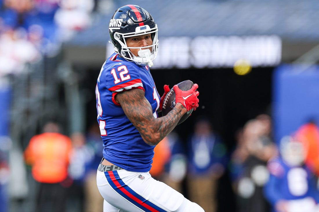 Oct 22, 2023; East Rutherford, New Jersey, USA; New York Giants tight end Darren Waller (12) catches the ball during the first half Washington Commanders at MetLife Stadium. Mandatory Credit: Vincent Carchietta-USA TODAY Sports