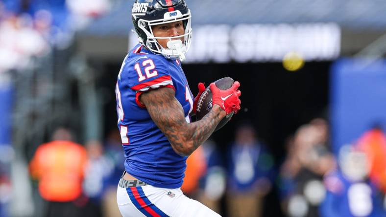 Oct 22, 2023; East Rutherford, New Jersey, USA; New York Giants tight end Darren Waller (12) catches the ball during the first half Washington Commanders at MetLife Stadium. Mandatory Credit: Vincent Carchietta-USA TODAY Sports