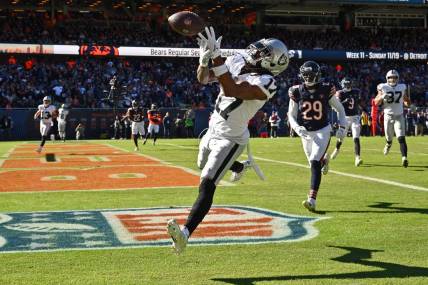 Oct 22, 2023; Chicago, Illinois, USA;  Las Vegas Raiders wide receiver Davante Adams (17) drops a pass in the end zone in the fourth quarter against the Chicago Bears at Soldier Field. Mandatory Credit: Jamie Sabau-USA TODAY Sports