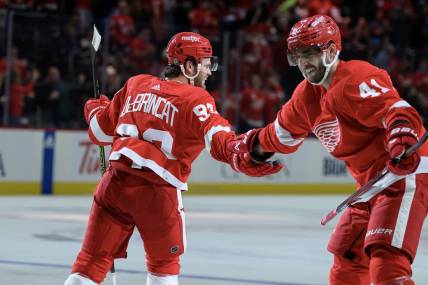 Oct 24, 2023; Detroit, Michigan, USA; Detroit Red Wings right wing Alex DeBrincat (93) celebrates with defenseman Shayne Gostisbehere (41)after scoring a power play goal against the Seattle Kraken in the third period at Little Caesars Arena. Mandatory Credit: Lon Horwedel-USA TODAY Sports