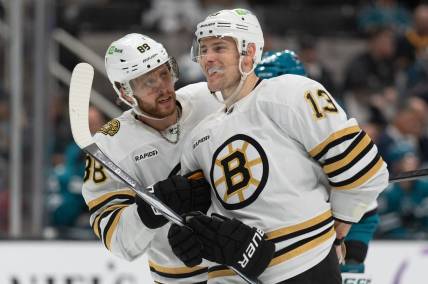 Oct 19, 2023; San Jose, California, USA;  Boston Bruins right wing David Pastrnak (88) converses with center Charlie Coyle (13) during the second period against the San Jose Sharks at SAP Center at San Jose. Mandatory Credit: Stan Szeto-USA TODAY Sports