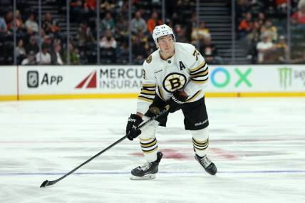 Oct 22, 2023; Anaheim, California, USA;  Boston Bruins defenseman Charlie McAvoy (73) skates with the puck during the NHL game against the Anaheim Ducks at Honda Center. Mandatory Credit: Kiyoshi Mio-USA TODAY Sports