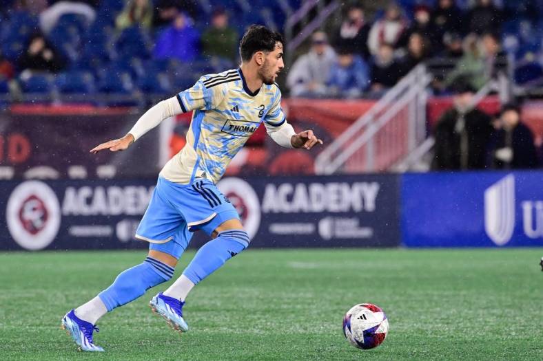 Oct 21, 2023; Foxborough, Massachusetts, USA; Philadelphia Union forward Julian Carranza (9) pushes the ball up field during the first half against the New England Revolution at Gillette Stadium. Mandatory Credit: Eric Canha-USA TODAY Sports