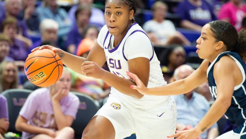 Mikaylah Williams (12) moves the ball as LSU Womens Basketball host East Texas Baptist. Thursday, Oct. 26, 2023.