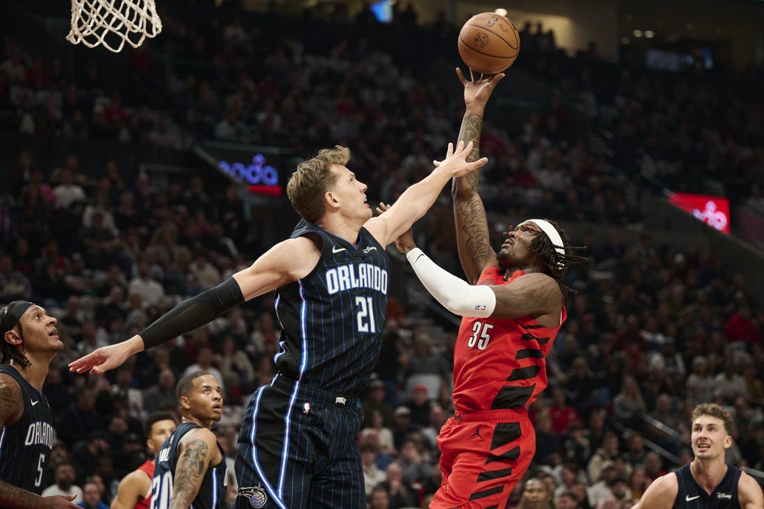 Oct 27, 2023; Portland, Oregon, USA; Portland Trail Blazers center Robert Williams III (35) shoots a basket during the first half against Orlando Magic center Moritz Wagner (21) at Moda Center. Mandatory Credit: Troy Wayrynen-USA TODAY Sports