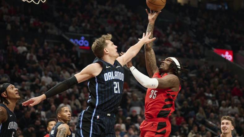 Oct 27, 2023; Portland, Oregon, USA; Portland Trail Blazers center Robert Williams III (35) shoots a basket during the first half against Orlando Magic center Moritz Wagner (21) at Moda Center. Mandatory Credit: Troy Wayrynen-USA TODAY Sports