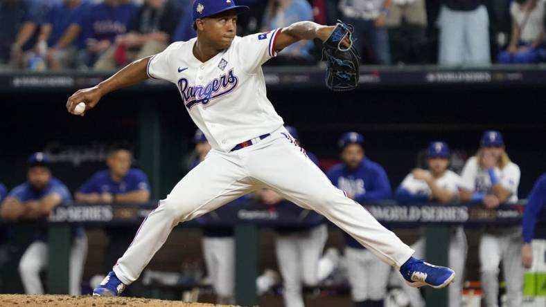 Oct 27, 2023; Arlington, TX, USA; Texas Rangers pitcher Jose Leclerc (25) throws during the tenth inning in game one of the 2023 World Series against the Arizona Diamondbacks at Globe Life Field.  Mandatory Credit: Raymond Carlin III-USA TODAY Sports