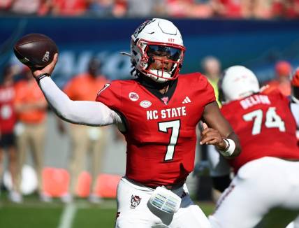 Oct 28, 2023; Raleigh, North Carolina, USA; North Carolina State Wolfpack quarterback MJ Morris (7) throws a pass during the first half against the Clemson Tigers at Carter-Finley Stadium. Mandatory Credit: Rob Kinnan-USA TODAY Sports