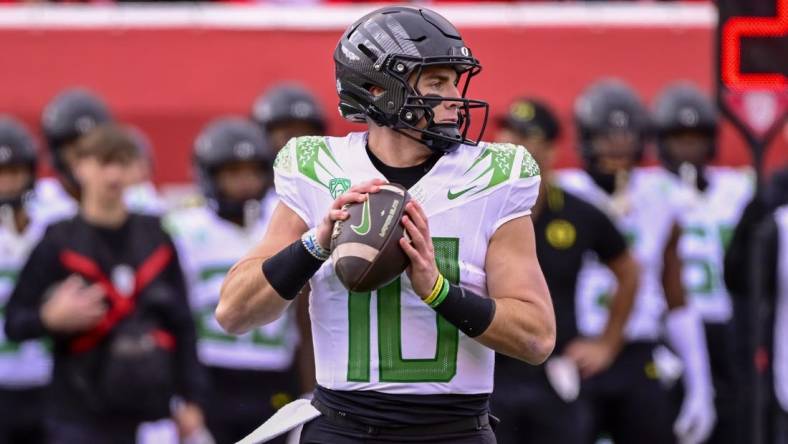 Oct 28, 2023; Salt Lake City, Utah, USA; Oregon Ducks quarterback Bo Nix (10) drops back to pass against the Utah Utes during the first half at Rice-Eccles Stadium. Mandatory Credit: Christopher Creveling-USA TODAY Sports