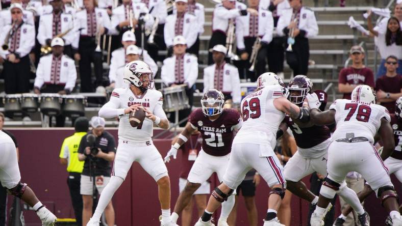 Oct 28, 2023; College Station, Texas, USA; South Carolina Gamecocks quarterback Spencer Rattler (7) looks for a pass against Texas A&M Aggies during the first quarter at Kyle Field. Mandatory Credit: Dustin Safranek-USA TODAY Sports