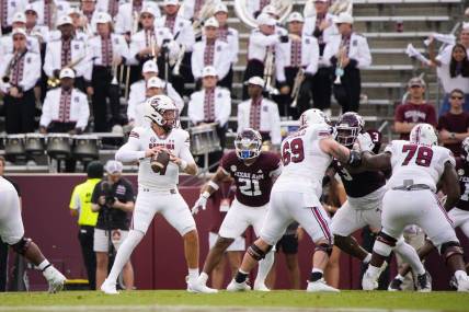 Oct 28, 2023; College Station, Texas, USA; South Carolina Gamecocks quarterback Spencer Rattler (7) looks for a pass against Texas A&M Aggies during the first quarter at Kyle Field. Mandatory Credit: Dustin Safranek-USA TODAY Sports