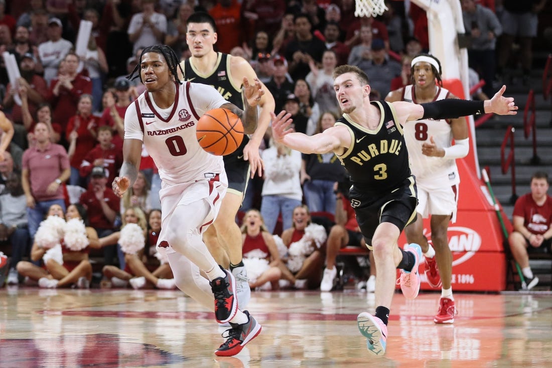 Oct 28, 2023; Fayetteville, AR, USA; Arkansas Razorbacks guard Khalif Battle (0) dribbles the ball against Purdue Boilermakers guard Braden Smith (3) on a fast break int he second half at Bud Walton Arena. Arkansas won 81-77. Mandatory Credit: Nelson Chenault-USA TODAY Sports