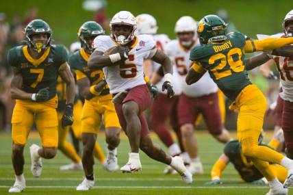 Oct 28, 2023; Waco, Texas, USA;  Iowa State Cyclones running back Cartevious Norton (5) runs past Baylor Bears safety Devyn Bobby (28) for a touchdown during the second half at McLane Stadium. Mandatory Credit: Chris Jones-USA TODAY Sports