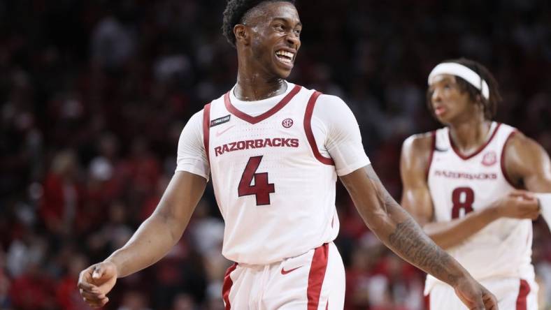 Oct 28, 2023; Fayetteville, AR, USA; Arkansas Razorbacks guard Davonte Davis (4) celebrates during the second half against the Purdue Boilermakers at Bud Walton Arena. Arkansas won 81-77. Mandatory Credit: Nelson Chenault-USA TODAY Sports