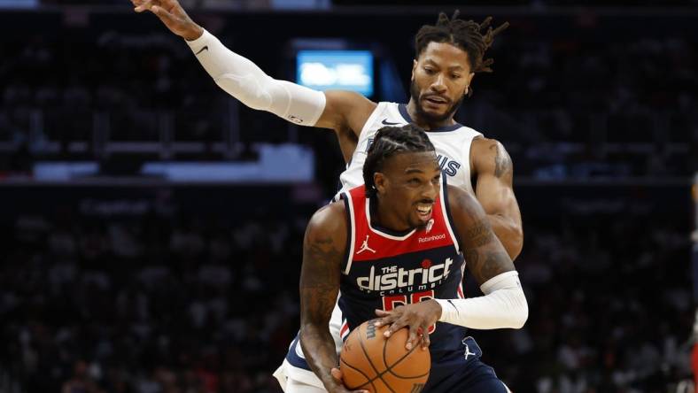 Oct 28, 2023; Washington, District of Columbia, USA; Washington Wizards guard Delon Wright (55) steals a pass intended for Memphis Grizzlies guard Derrick Rose (23) in the fourth quarter at Capital One Arena. Mandatory Credit: Geoff Burke-USA TODAY Sports