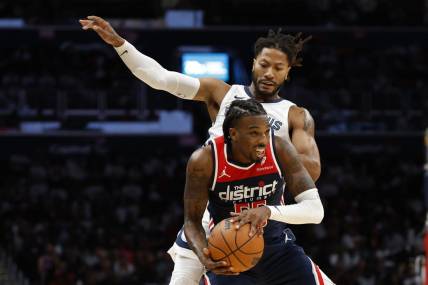 Oct 28, 2023; Washington, District of Columbia, USA; Washington Wizards guard Delon Wright (55) steals a pass intended for Memphis Grizzlies guard Derrick Rose (23) in the fourth quarter at Capital One Arena. Mandatory Credit: Geoff Burke-USA TODAY Sports