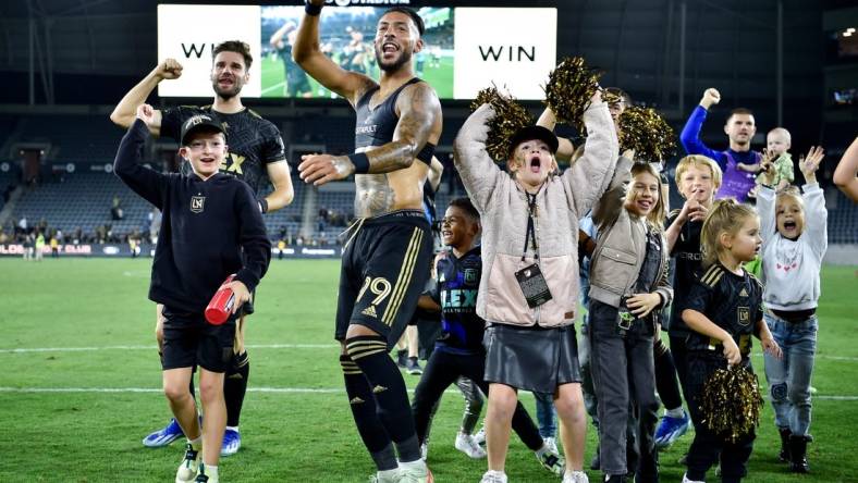 Oct 28, 2023; Los Angeles, CA, USA; Los Angeles FC forward Denis Bouanga (99) celebrates on the field after the match against the Vancouver Whitecaps FC in game one in a round one match of the 2023 MLS Cup Playoffs at BMO Stadium. Mandatory Credit: Jon Durr-USA TODAY Sports