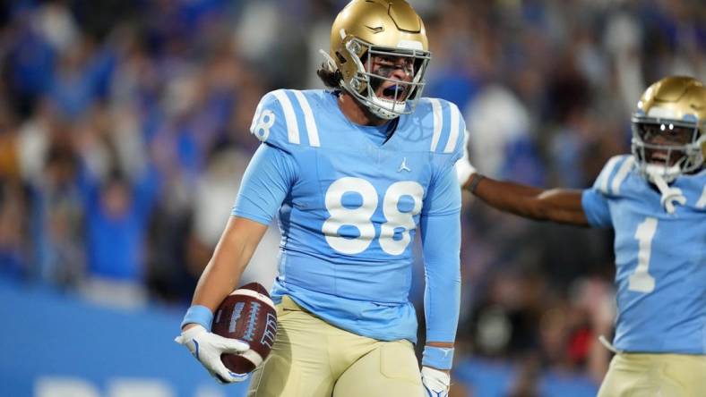 Oct 28, 2023; Pasadena, California, USA; UCLA Bruins tight end Moliki Matavao (88) celebrates after scoring on a 26-yard touchdown reception against the Colorado Buffaloes in the second half at Rose Bowl. UCLA defeated Colorado 28-16. Mandatory Credit: Kirby Lee-USA TODAY Sports