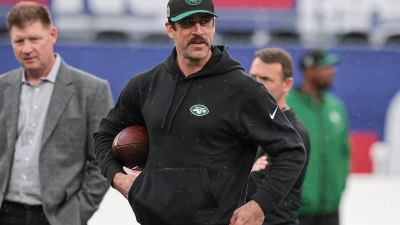 Oct 29, 2023; East Rutherford, New Jersey, USA; New York Jets quarterback Aaron Rodgers (8) on the field before the game against the New York Giants at MetLife Stadium. Mandatory Credit: Vincent Carchietta-USA TODAY Sports