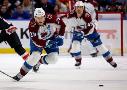 Oct 29, 2023; Buffalo, New York, USA;  Colorado Avalanche center Nathan MacKinnon (29) skates up ice for a loose puck during the first period against the Buffalo Sabres at KeyBank Center. Mandatory Credit: Timothy T. Ludwig-USA TODAY Sports