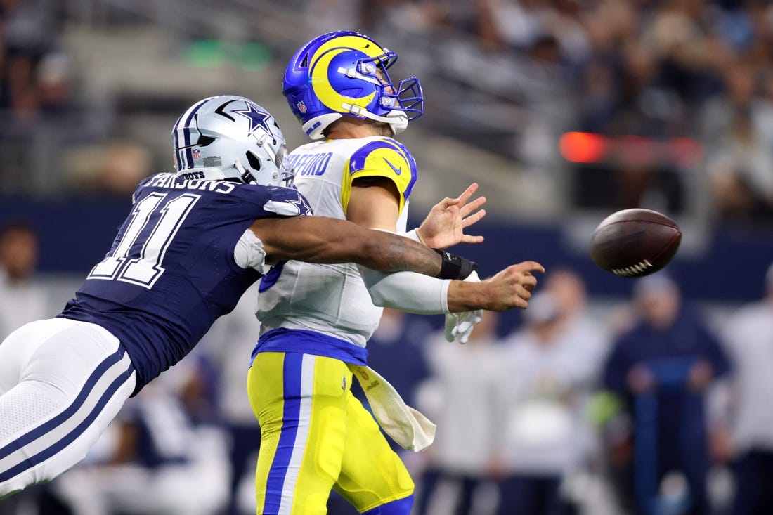 Oct 29, 2023; Arlington, Texas, USA; Dallas Cowboys linebacker Micah Parsons (11) attempts to sack Los Angeles Rams quarterback Matthew Stafford (9) in the second quarter at AT&T Stadium. Mandatory Credit: Tim Heitman-USA TODAY Sports