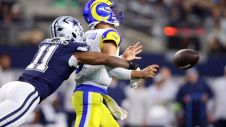 Oct 29, 2023; Arlington, Texas, USA; Dallas Cowboys linebacker Micah Parsons (11) attempts to sack Los Angeles Rams quarterback Matthew Stafford (9) in the second quarter at AT&T Stadium. Mandatory Credit: Tim Heitman-USA TODAY Sports