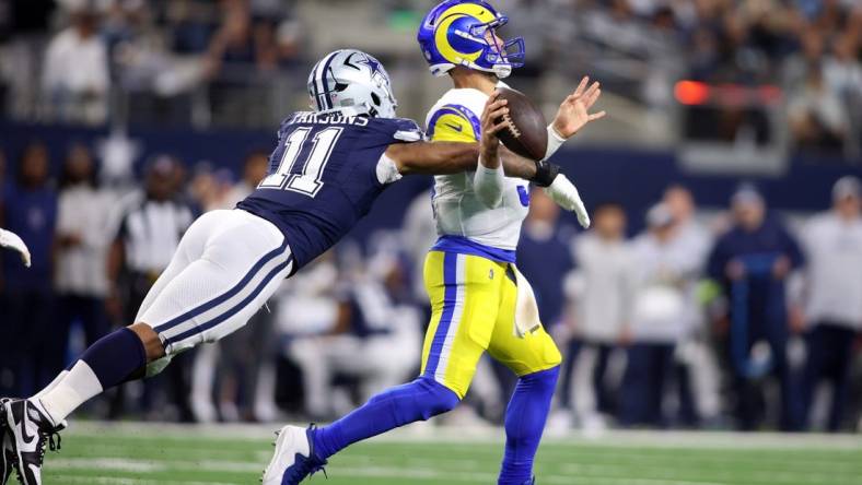 Oct 29, 2023; Arlington, Texas, USA; Dallas Cowboys linebacker Micah Parsons (11) attempts to sack Los Angeles Rams quarterback Matthew Stafford (9) in the second quarter at AT&T Stadium. Mandatory Credit: Tim Heitman-USA TODAY Sports