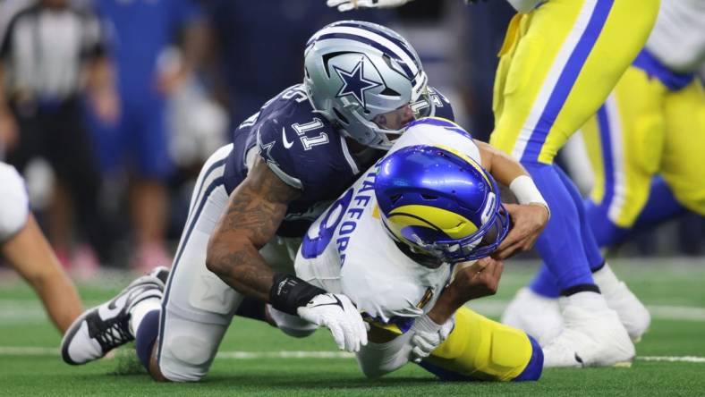 Oct 29, 2023; Arlington, Texas, USA; Los Angeles Rams quarterback Matthew Stafford (9) is sacked by Dallas Cowboys linebacker Micah Parsons (11) in the second quarter at AT&T Stadium. Mandatory Credit: Tim Heitman-USA TODAY Sports