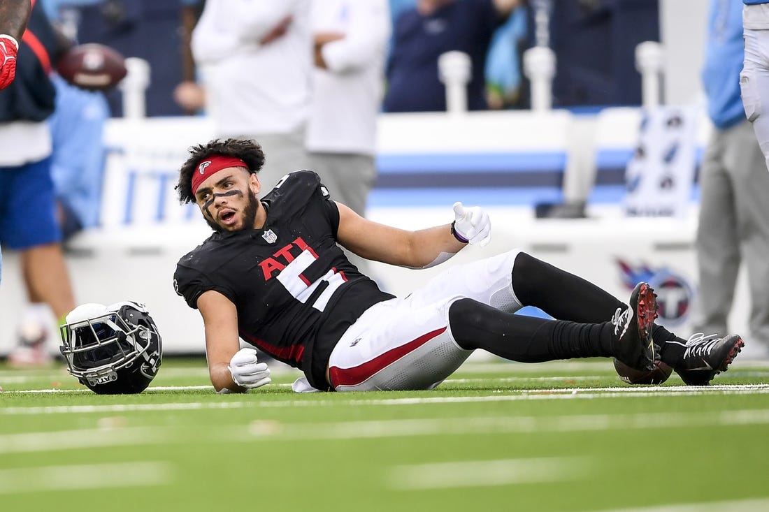 Oct 29, 2023; Nashville, Tennessee, USA;  Atlanta Falcons wide receiver Drake London (5) lays on the field after taking a hit from Tennessee Titans linebacker Jack Gibbens (50) during the second half at Nissan Stadium. Mandatory Credit: Steve Roberts-USA TODAY Sports