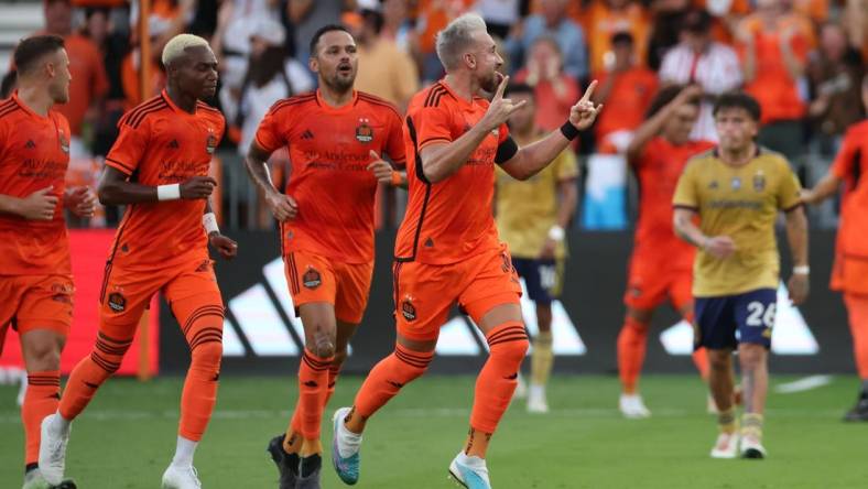 Oct 29, 2023; Houston, TX, USA; Houston Dynamo midfielder Hector Herrera (16) reacts after scoring a goal against Real Salt Lake game one in a round one match of the 2023 MLS Cup Playoffs at Shell Energy Stadium. Mandatory Credit: Thomas Shea-USA TODAY Sports