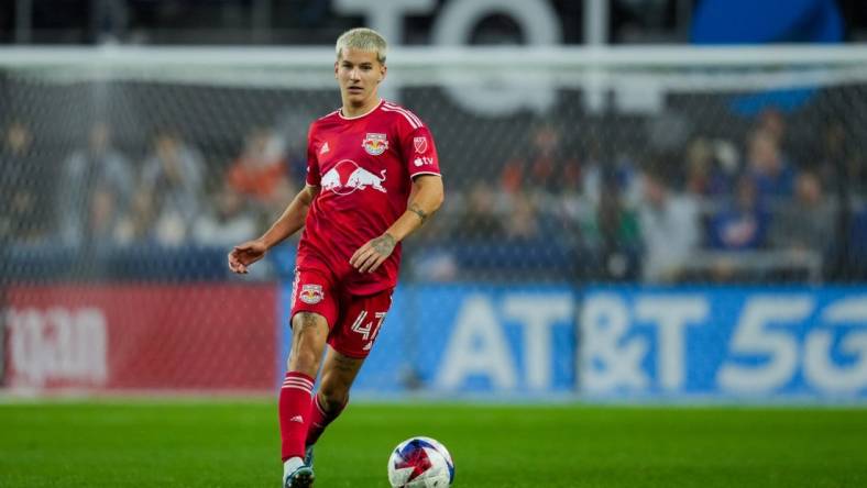 Oct 29, 2023; Cincinnati, OH, USA; New York Red Bulls defender John Tolkin (47) dribbles the ball against FC Cincinnati in the second half of game one in a round one match of the 2023 MLS Cup Playoffs at TQL Stadium. Mandatory Credit: Aaron Doster-USA TODAY Sports