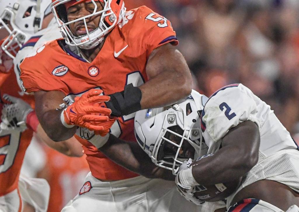 Sep 16, 2023; Clemson, South Carolina; Clemson linebacker Jeremiah Trotter Jr. (54) tackles Florida Atlantic running back Zuberi Mobley (2) the third quarter with Florida Atlantic at Memorial Stadium. Mandatory Credit: Ken Ruinard-USA TODAY NETWORK