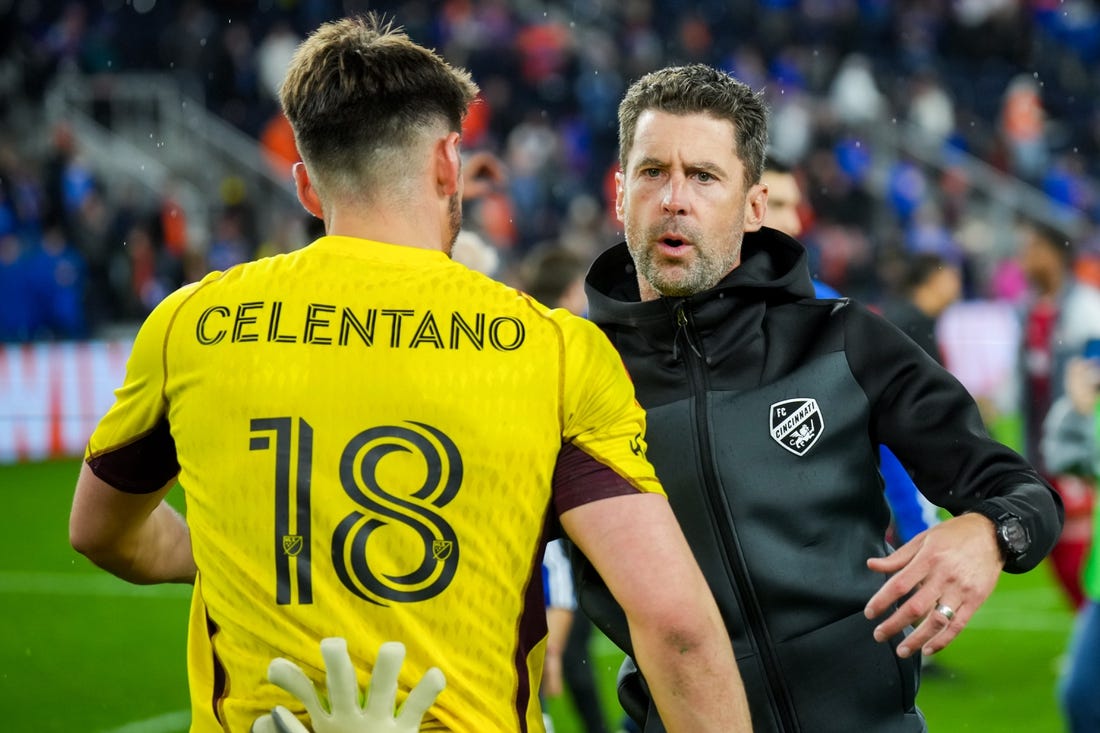 Oct 29, 2023; Cincinnati, OH, USA; FC Cincinnati head coach Pat Noonan hugs goalkeeper Roman Celentano (18) on the field after his team defeats the New York Red Bulls in game one in a round one match of the 2023 MLS Cup Playoffs at TQL Stadium. Mandatory Credit: Aaron Doster-USA TODAY Sports