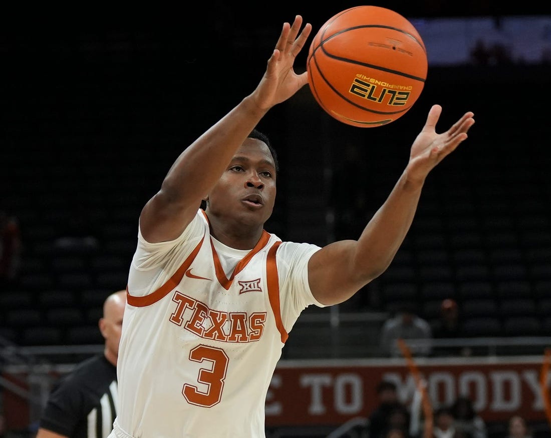 Texas Longhorns guard Max Abmas (3) passes to a teammate during a scrimmage against St. Edward's University on Monday, Oct. 30, 2023.