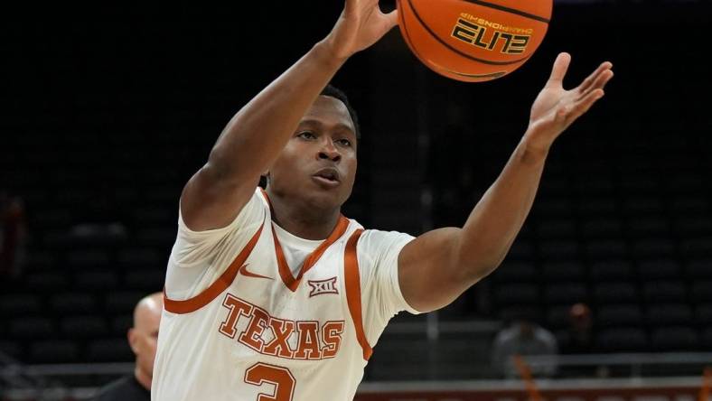 Texas Longhorns guard Max Abmas (3) passes to a teammate during a scrimmage against St. Edward's University on Monday, Oct. 30, 2023.