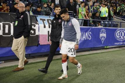 Oct 30, 2023; Seattle, Washington, USA; FC Dallas midfielder Alan Velasco (20) leaves the field after being injured in the first half against the Seattle Sounders FC in game one of a round one match of the 2023 MLS Cup Playoffs at Lumen Field. Mandatory Credit: Joe Nicholson-USA TODAY Sports