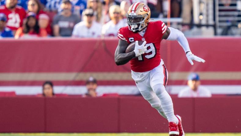 September 21, 2023; Santa Clara, California, USA; San Francisco 49ers wide receiver Deebo Samuel (19) carries the football during the second quarter against the New York Giants at Levi's Stadium. Mandatory Credit: Kyle Terada-USA TODAY Sports