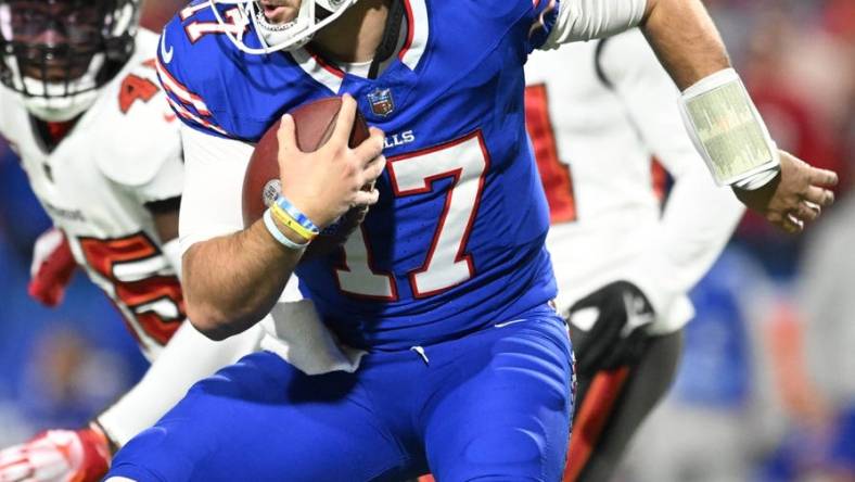 Oct 26, 2023; Orchard Park, New York, USA; Buffalo Bills quarterback Josh Allen (17) runs the ball against the Tampa Bay Buccaneers in the first quarter at Highmark Stadium. Mandatory Credit: Mark Konezny-USA TODAY Sports