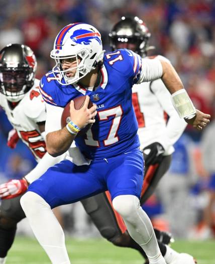 Oct 26, 2023; Orchard Park, New York, USA; Buffalo Bills quarterback Josh Allen (17) runs the ball against the Tampa Bay Buccaneers in the first quarter at Highmark Stadium. Mandatory Credit: Mark Konezny-USA TODAY Sports