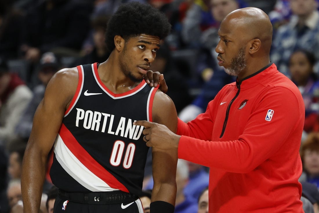 Nov 1, 2023; Detroit, Michigan, USA;  Portland Trail Blazers head coach Chauncey Billups talks to guard Scoot Henderson (00) in the first half against the Detroit Pistons at Little Caesars Arena. Mandatory Credit: Rick Osentoski-USA TODAY Sports