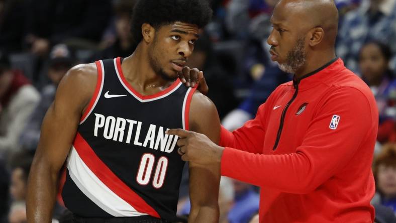 Nov 1, 2023; Detroit, Michigan, USA;  Portland Trail Blazers head coach Chauncey Billups talks to guard Scoot Henderson (00) in the first half against the Detroit Pistons at Little Caesars Arena. Mandatory Credit: Rick Osentoski-USA TODAY Sports