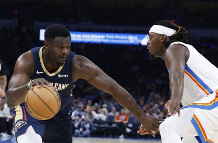 Nov 1, 2023; Oklahoma City, Oklahoma, USA; New Orleans Pelicans forward Zion Williamson (1) drives against Oklahoma City Thunder guard Luguentz Dort (5) during the second half at Paycom Center. New Orleans won 110-106. Mandatory Credit: Alonzo Adams-USA TODAY Sports