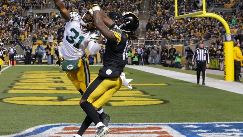 Green Bay Packers cornerback Davon House (31) commits pass interference in the end zone while covering Pittsburgh Steelers wide receiver Martavis Bryant (10) during the third quarter of their game, November 26, 2017 at Heinz Field in Pittsburgh, Pa. The Pittsburgh Steelers beat the Green Bay Packers 31-28 on a field goal as time expired.