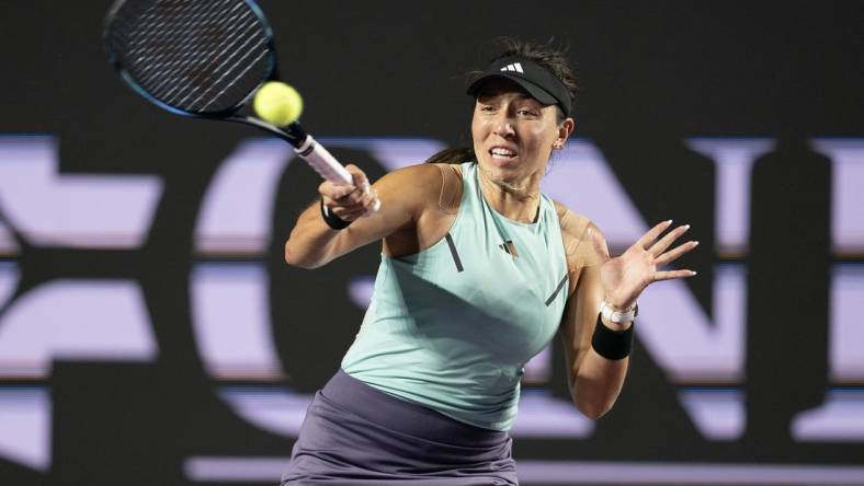 Nov 2, 2023; Cancun, Mexico; Jessica Pegula (USA) returns a shot during her match against Maria Sakkari (GRE) on day five of the GNP Saguaros WTA Finals Cancun. Mandatory Credit: Susan Mullane-USA TODAY Sports