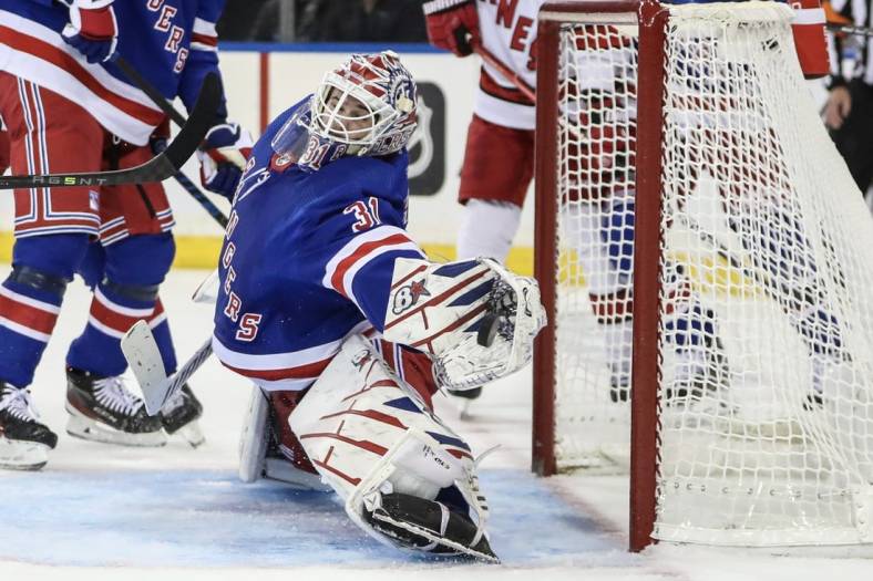 Nov 2, 2023; New York, New York, USA; New York Rangers goaltender Igor Shesterkin (31) makes a save on a shot on goal attempt in the third period against the Carolina Hurricanes at Madison Square Garden. Mandatory Credit: Wendell Cruz-USA TODAY Sports