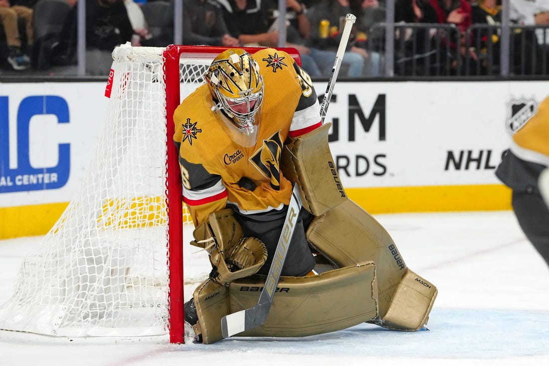 Nov 2, 2023; Las Vegas, Nevada, USA; Vegas Golden Knights goaltender Logan Thompson (36) absorbs a Winnipeg Jets shot during the second period at T-Mobile Arena. Mandatory Credit: Stephen R. Sylvanie-USA TODAY Sports