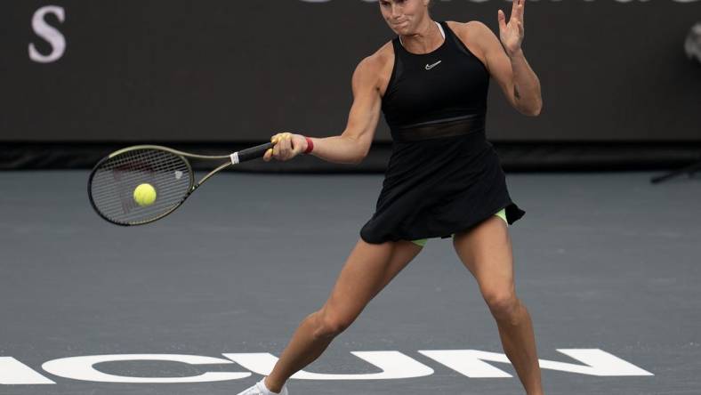 Nov 3, 2023; Cancun, Mexico;  Aryna Sabalenka returns a shot during her match against Elena Rybakina (KAZ) on day six of the GNP Saguaros WTA Finals Cancun. Mandatory Credit: Susan Mullane-USA TODAY Sports